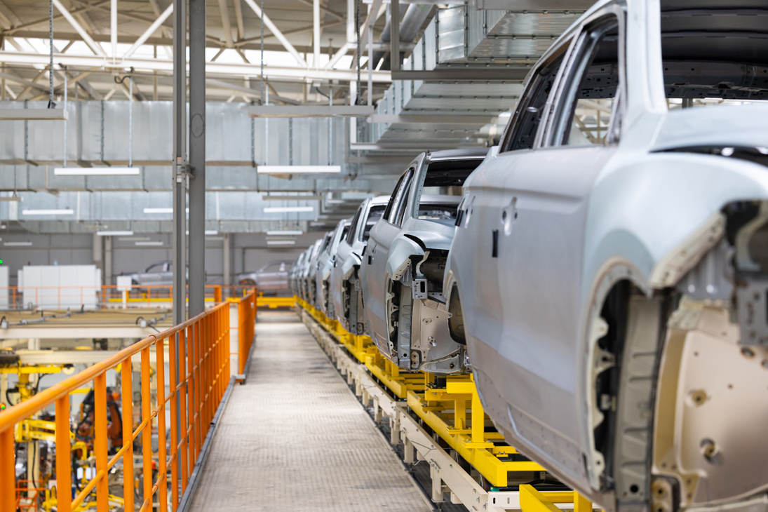 Photo of Car Bodies on Assembly Line. Factory for Production of Autos. Modern Automotive Industry. Electric Car Factory, Conveyor